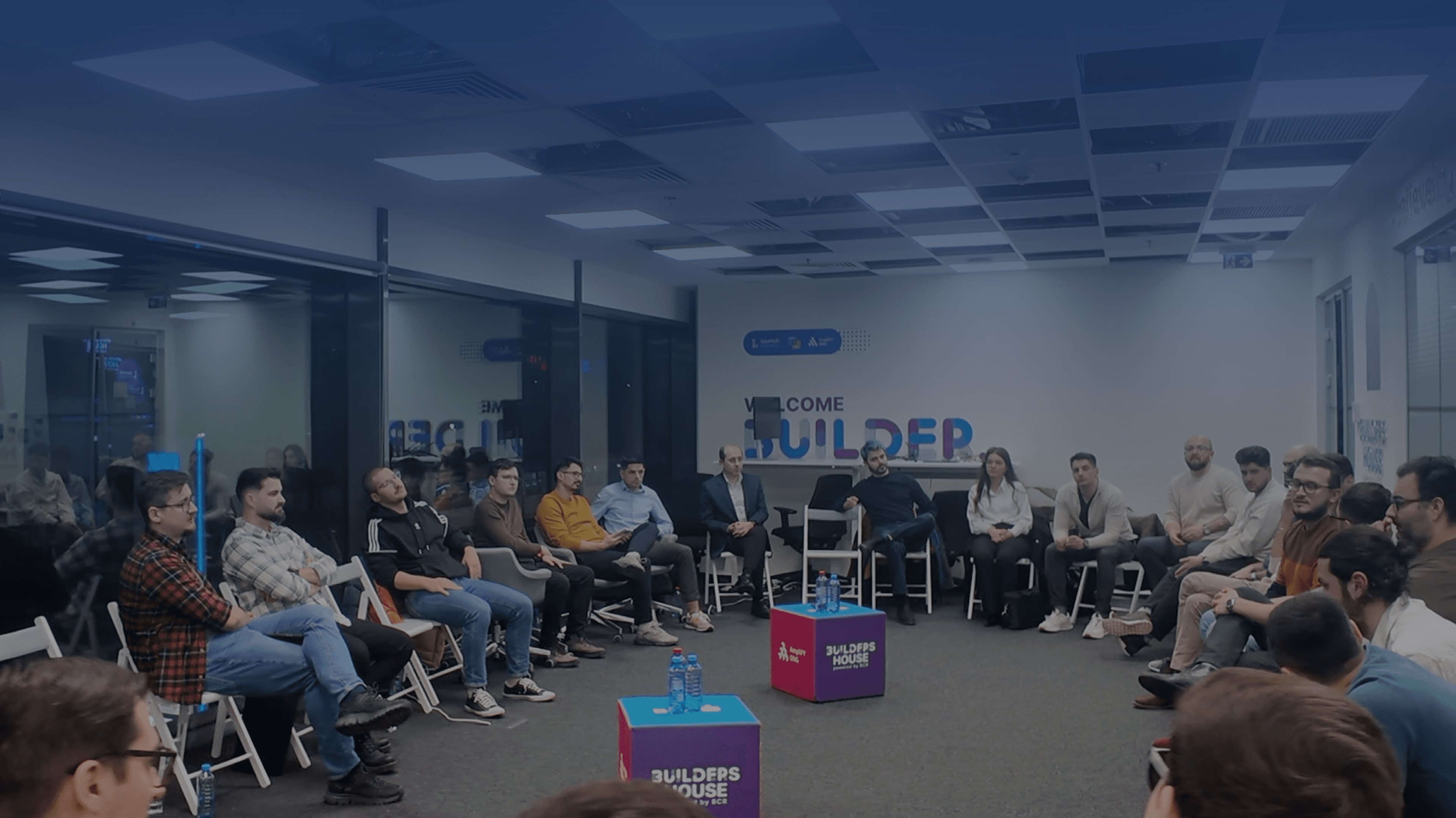 DevNights members gathered in a circle at the main event