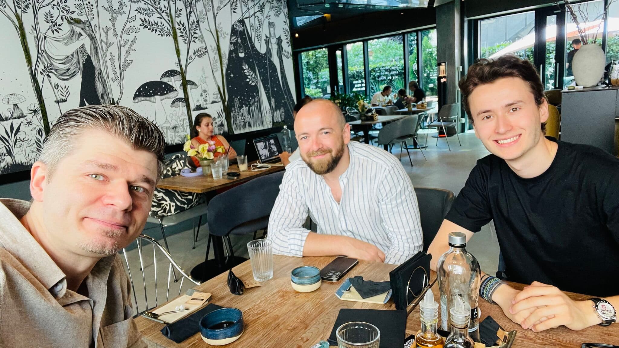 The three people behind DevNights meeting together