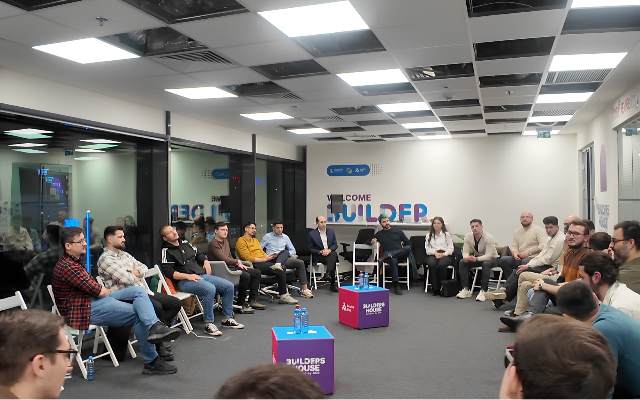 People gathered in a DevNights room during a guided developer conversation