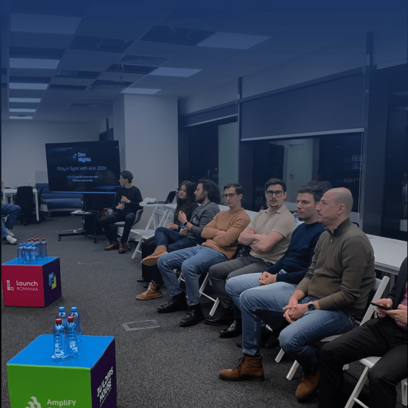 DevNights members gathered in a circle at the main event